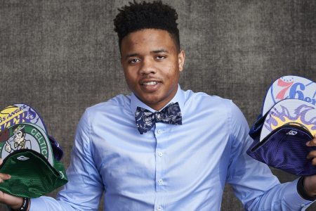 Likely #1 NBA draft pick Markelle Fultz poses with team caps.  (Jennifer Pottheiser/NBAE via Getty Images)