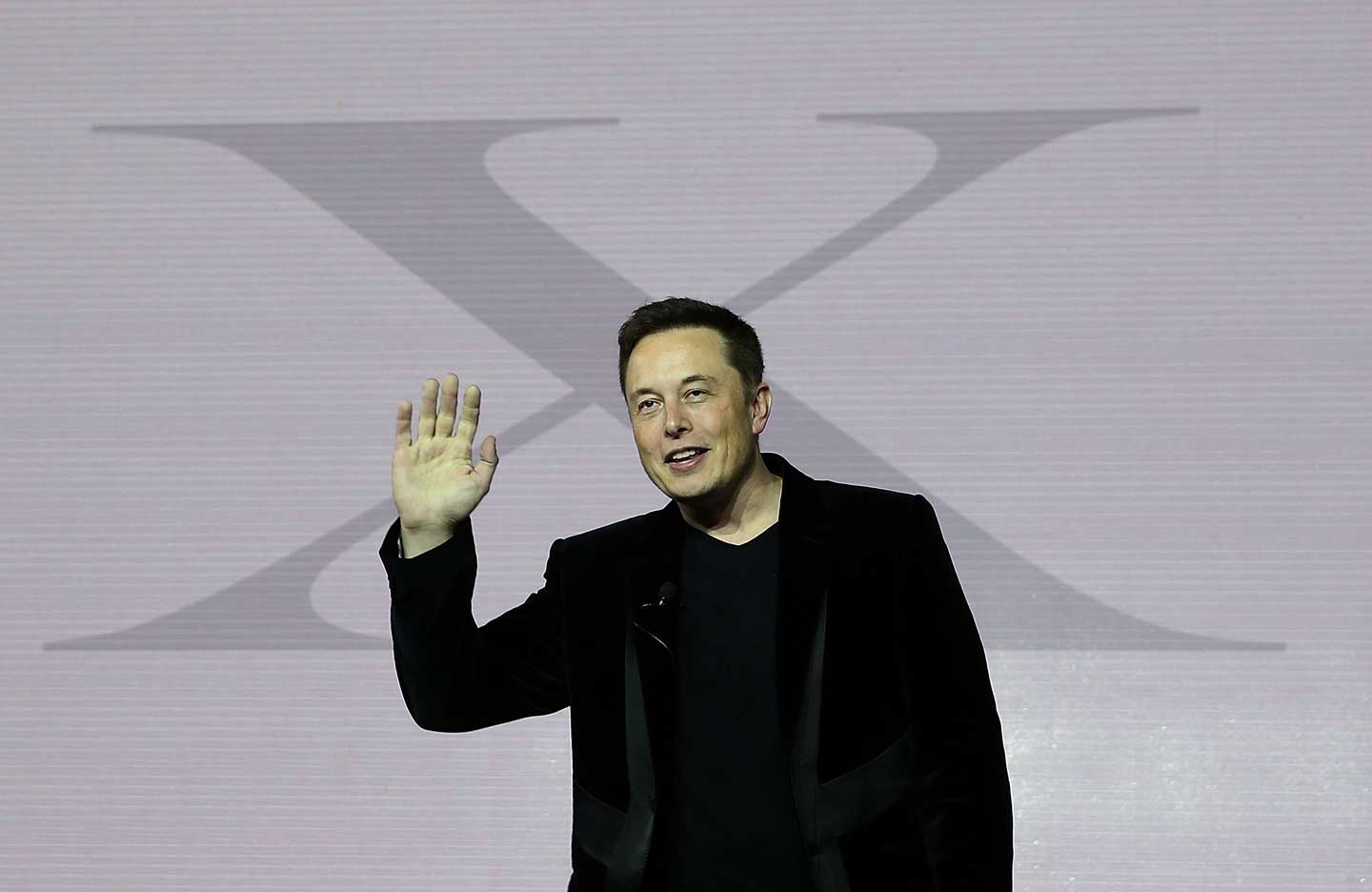 Tesla CEO Elon Musk speaks during an event to launch the new Tesla Model X Crossover SUV on September 29, 2015 in Fremont, California. Musk recently announced a major donation to Flint Community Schools. (Justin Sullivan/Getty Images)