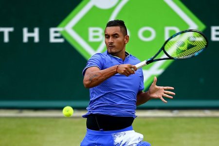 Nick Kyrgios of Australia plays a forehand during his tennis match against Viktor Troicki of Serbia during day four of The Boodles Tennis Event at Stoke Park on June 30, 2017 in Stoke Poges, England.