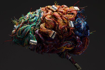 A model of the human brain constructed of wires and ports. (Getty)