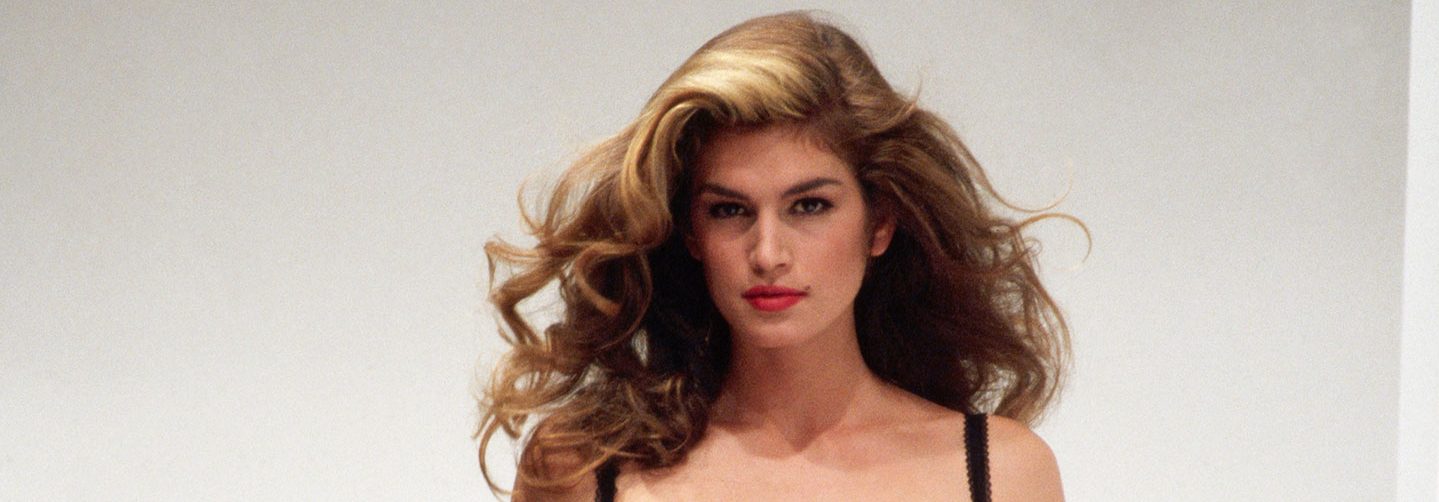 Cindy Crawford models Dolce e Gabbana clothes at a fashion show in Milan. (Photo by Vittoriano Rastelli/CORBIS/Corbis via Getty Images)
