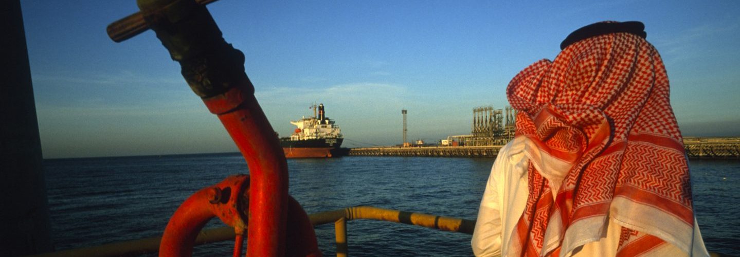 A man stands on a platform on an oil and gas terminal on January 2003 in n the Persian Gulf off of Ras Al Tanoura, Saudi Arabia. (Reza/Getty Images)