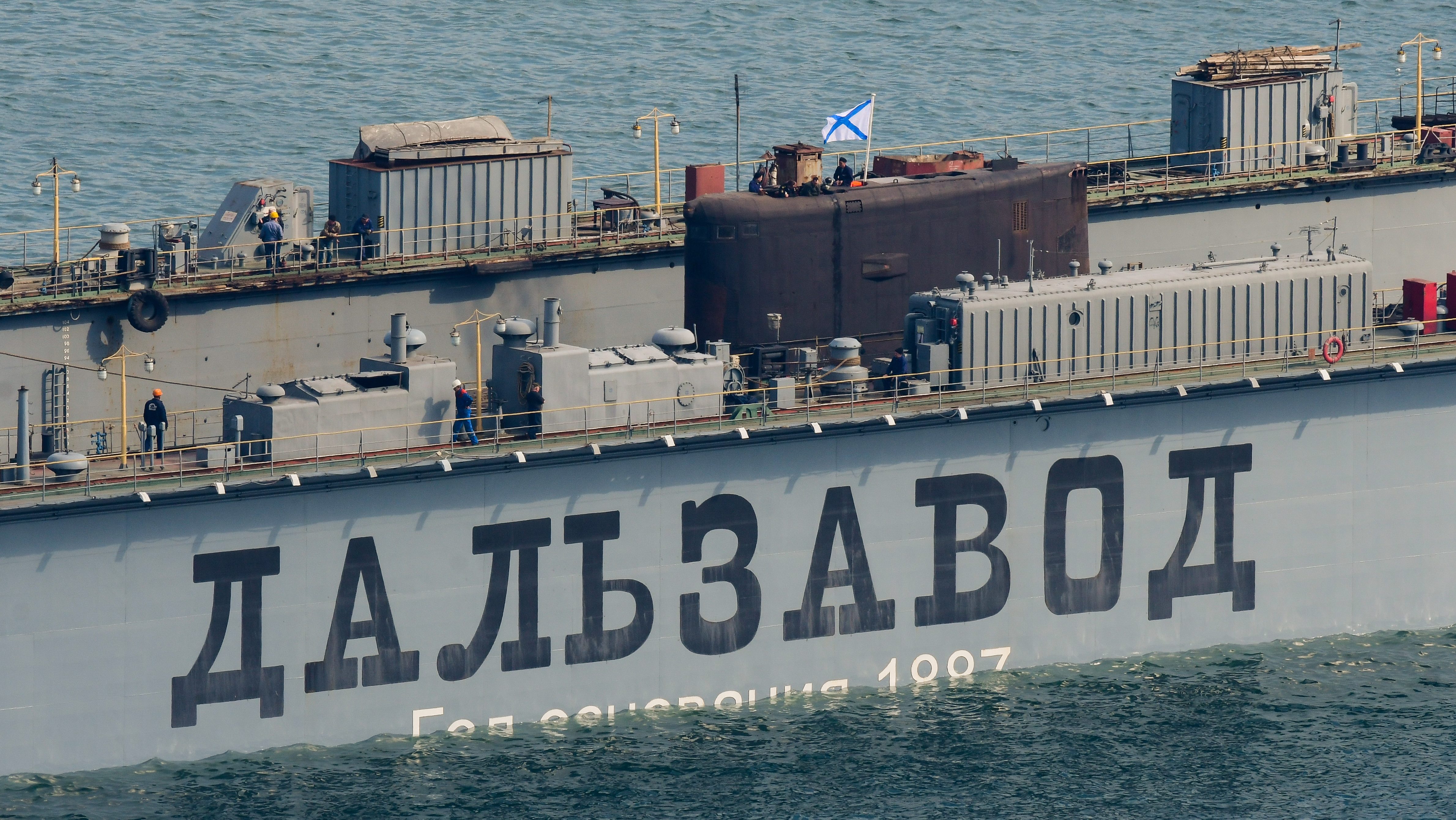 Pictured in this file image dated April 15, 2017 is a submarine undocking at the Dalzavod Ship Repair Centre in Vladivostok, the main repair facility servicing yearly over 200 ships for the Russian Pacific surface and diesel electric submarine fleet; in 2017 Dalzavod celebrates its 130th anniversary. File Photo/Yuri Smityuk/TASS (Photo by Yuri SmityukTASS via Getty Images)