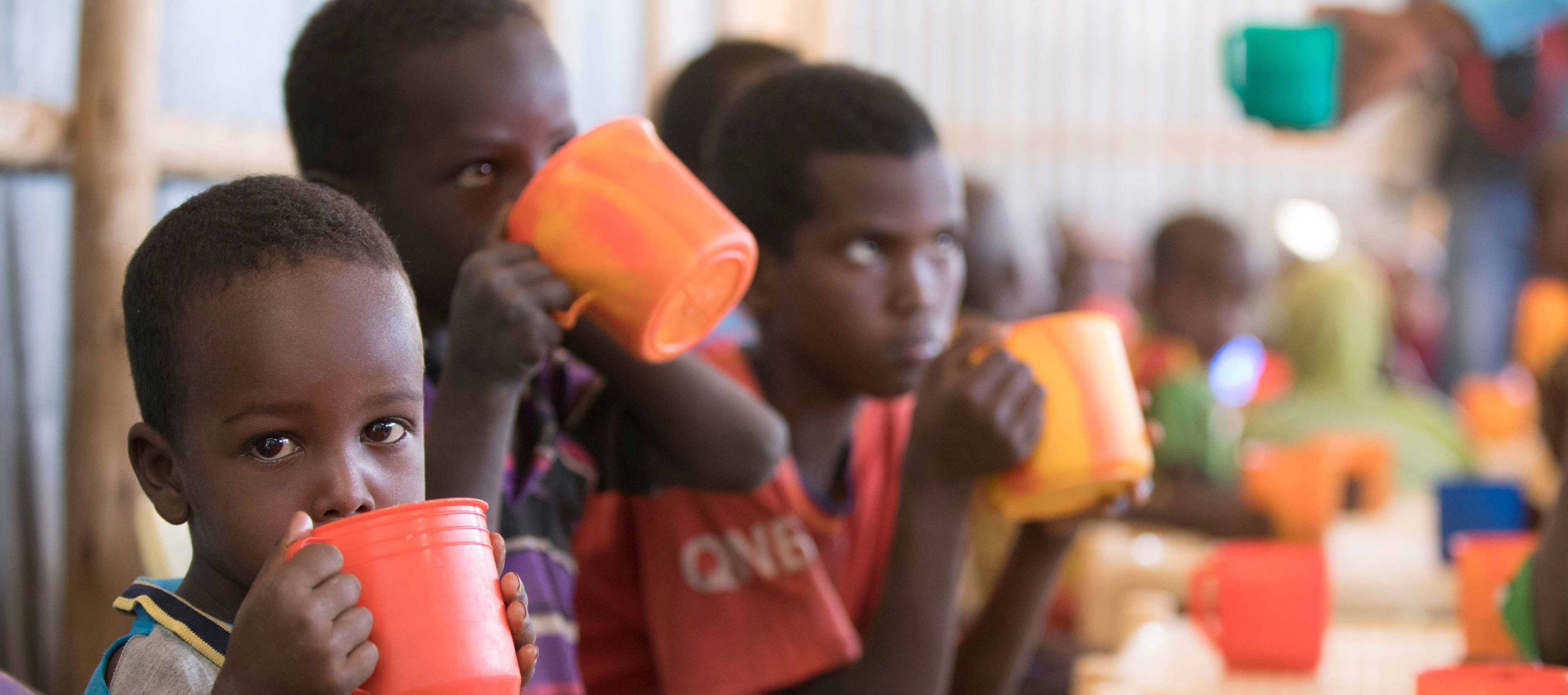 Young children drink a high protein mix provided by the World Food Programme (WFP) during a school feeding programme at Mekladida refugee camp in the Somali region of Ethiopia on December 19, 2017.
(ZACHARIAS ABUBEKER/AFP/Getty Images)