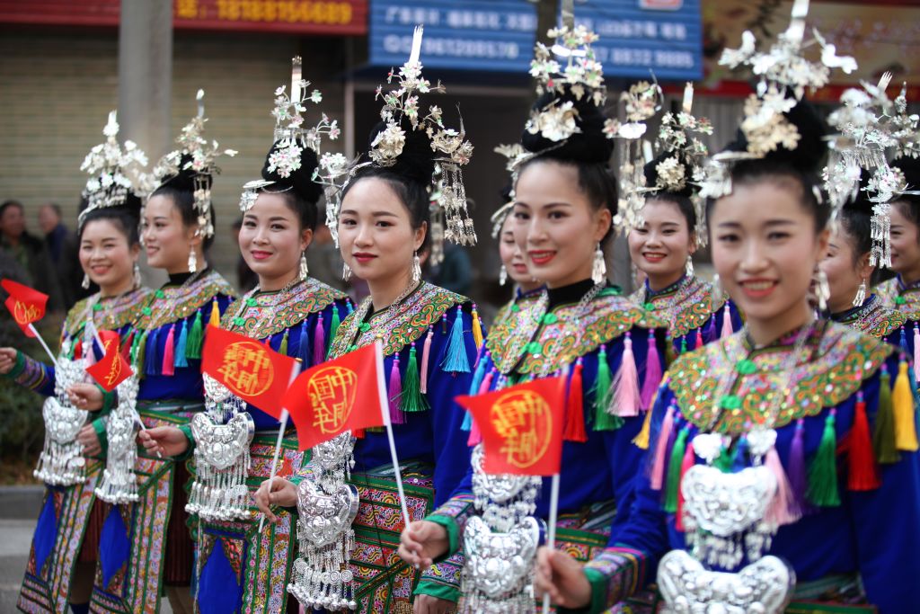 Members of the Dong ethnic minority in traditional costumes parade during their traditional Dong Year festival on December 18, 2017 in Liping, China. The Dong Year is the traditional festival of China's Dong ethnic minority, and it is celebrated during the eleventh lunar month, from the first day to the eleventh day.  (Photo by Qu Honglun/China News Service/VCG via Getty Images)