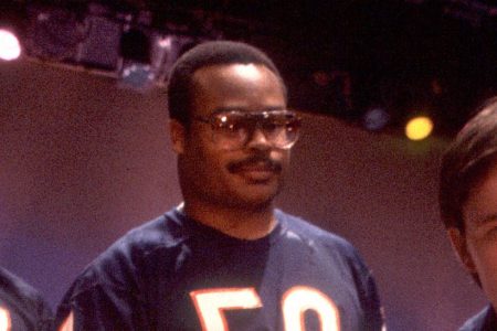 Mike Richardson (left), Hall of Fame linebacker Mike Singletary (center), and Gary Fencik (right) of the Chicago Bears get instruction from Dick Meyer during filming of "The Super Bowl Shuffle" in Chicago in 1985. (Paul Natkin/Getty Images)