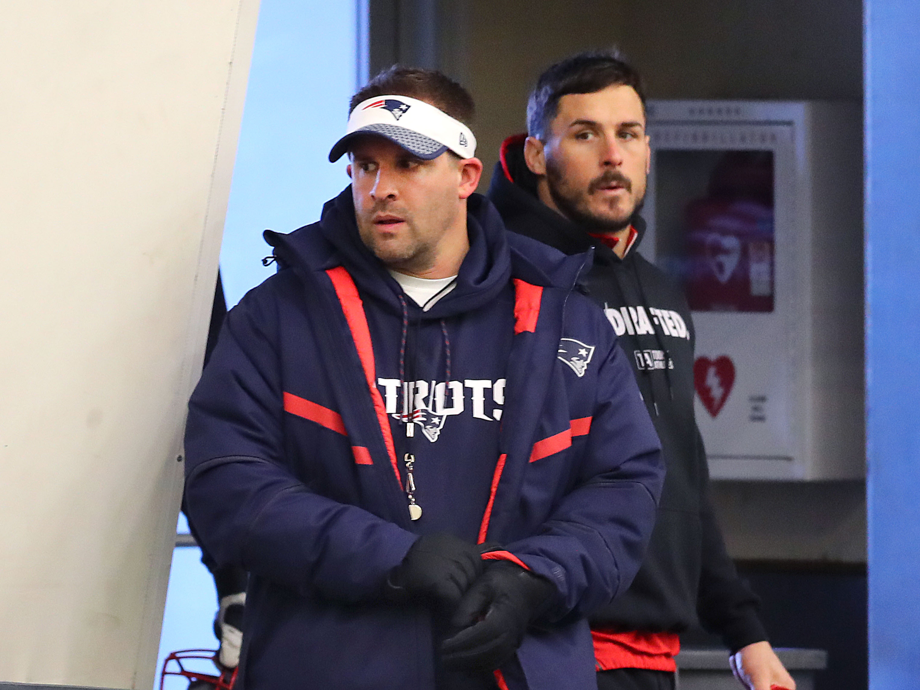 New England Patriots assistant coach Josh McDaniels, left, and Danny Amendola, right, arrive inside the practice bubble at Gillette Stadium in Foxborough, Mass., Jan. 26, 2018. (John Tlumacki/The Boston Globe via Getty Images)