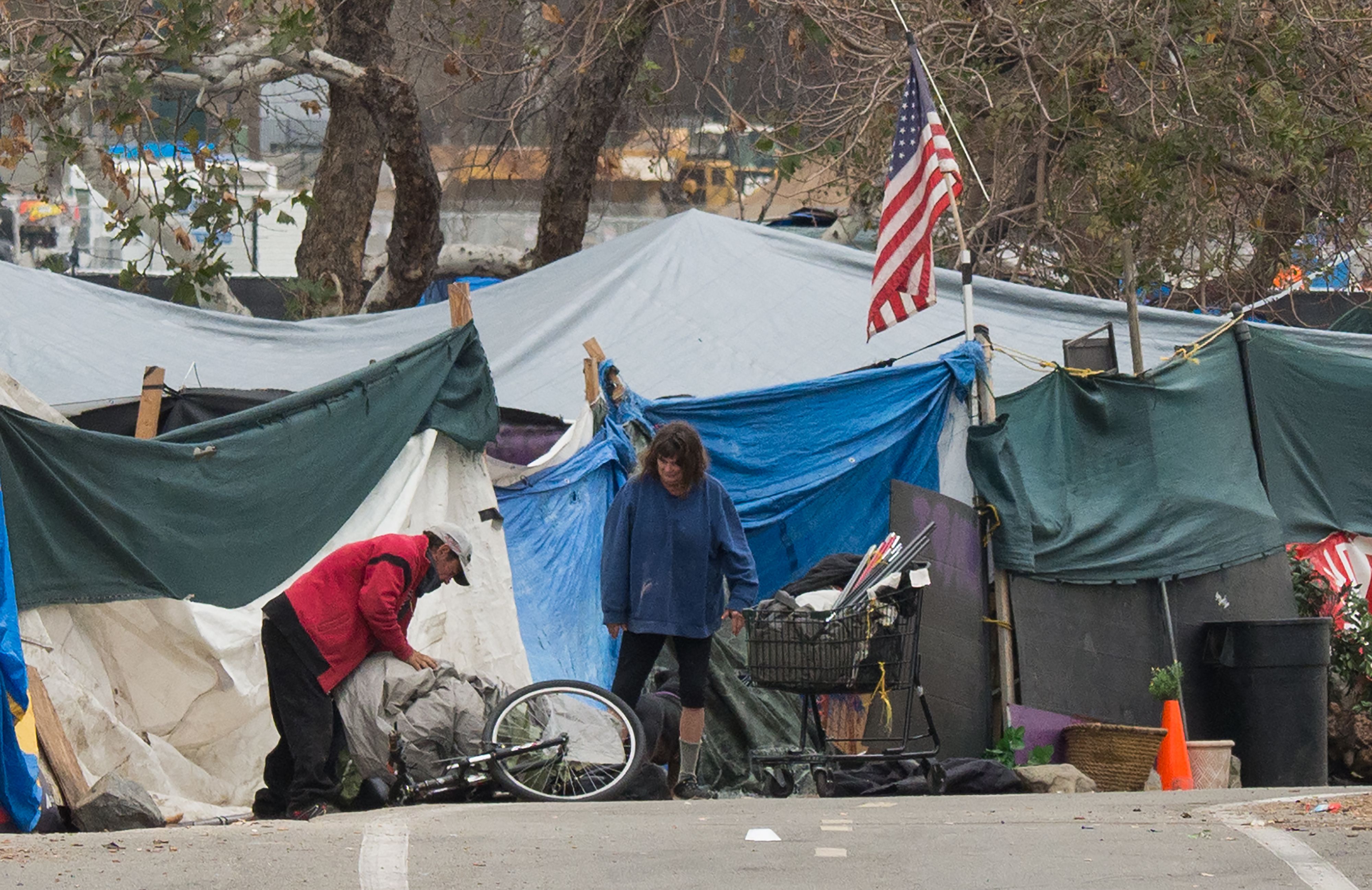 A homeless encampment made of tents and tarps lines the Santa Ana riverbed near Angel Stadium in Anaheim, California, January 25, 2018. (ROBYN BECK/AFP/Getty Images)