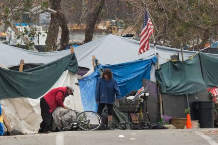 A homeless encampment made of tents and tarps lines the Santa Ana riverbed near Angel Stadium in Anaheim, California, January 25, 2018. (ROBYN BECK/AFP/Getty Images)