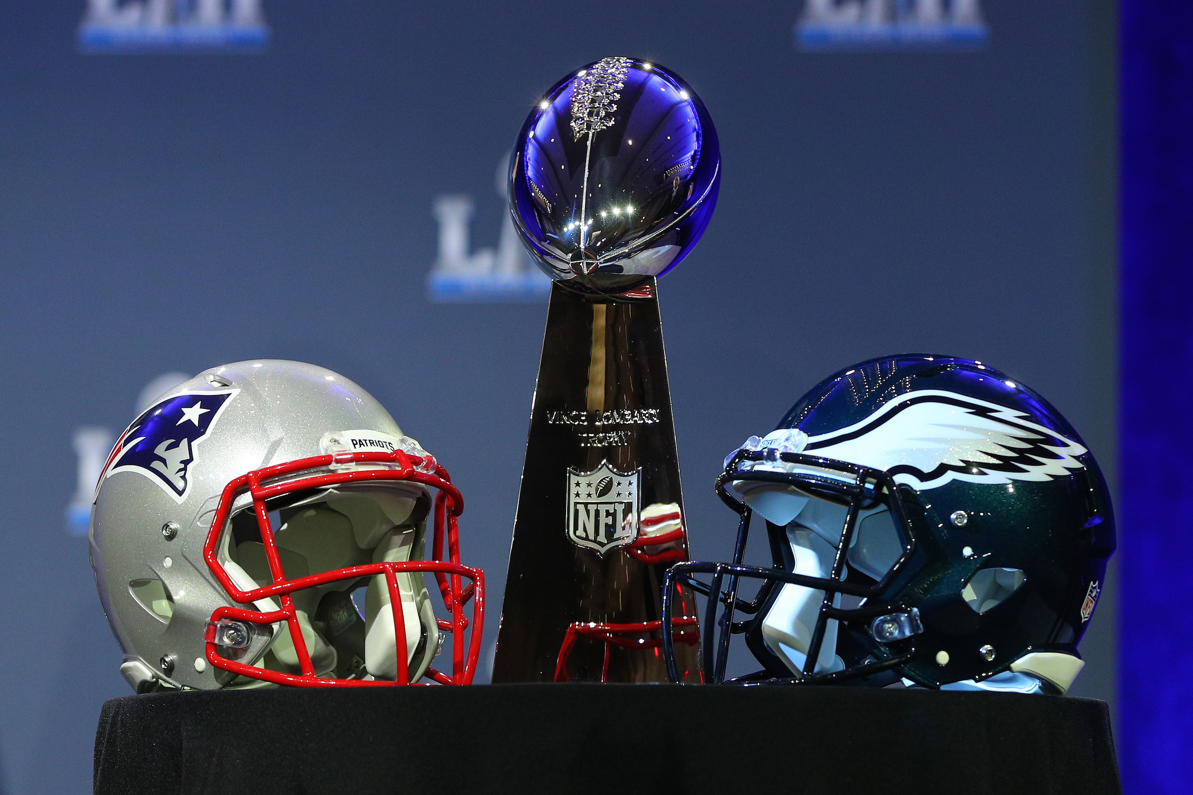 The Vince Lombardi Trophy and the New England Patriots helmet and the Philadelphia Eagles helmet on display at the Commissioners Press Conference on January 31, 2018, at the Hilton Minneapolis Grand Ballroom, in Minneapolis, MN.  (Photo by Rich Graessle/Icon Sportswire via Getty Images)