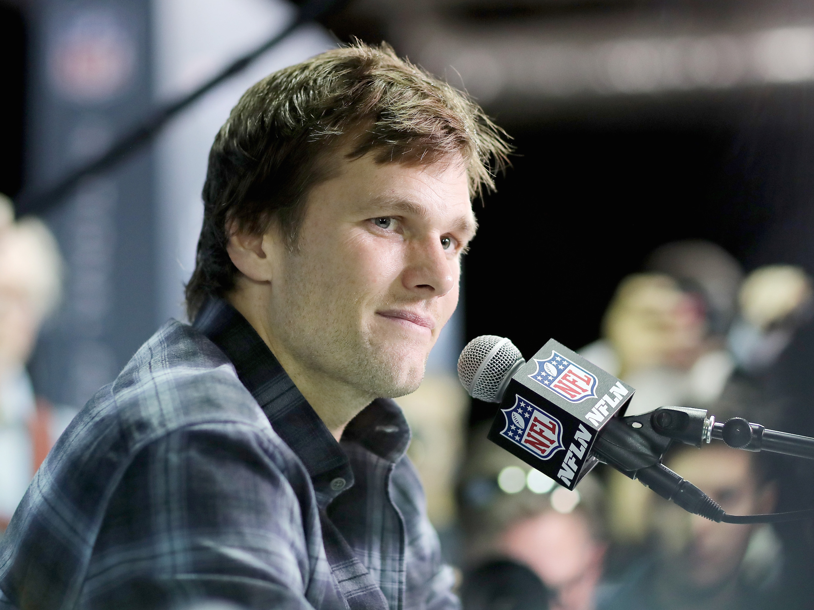 Tom Brady #12 of the New England Patriots speaks to the press during the New England Patriots Media Availability for Super Bowl LII at the Mall of America on February 1, 2018 in Bloomington, Minnesota.The New England Patriots will take on the Philadelphia Eagles in Super Bowl LII on February 4.  (Photo by Elsa/Getty Images)