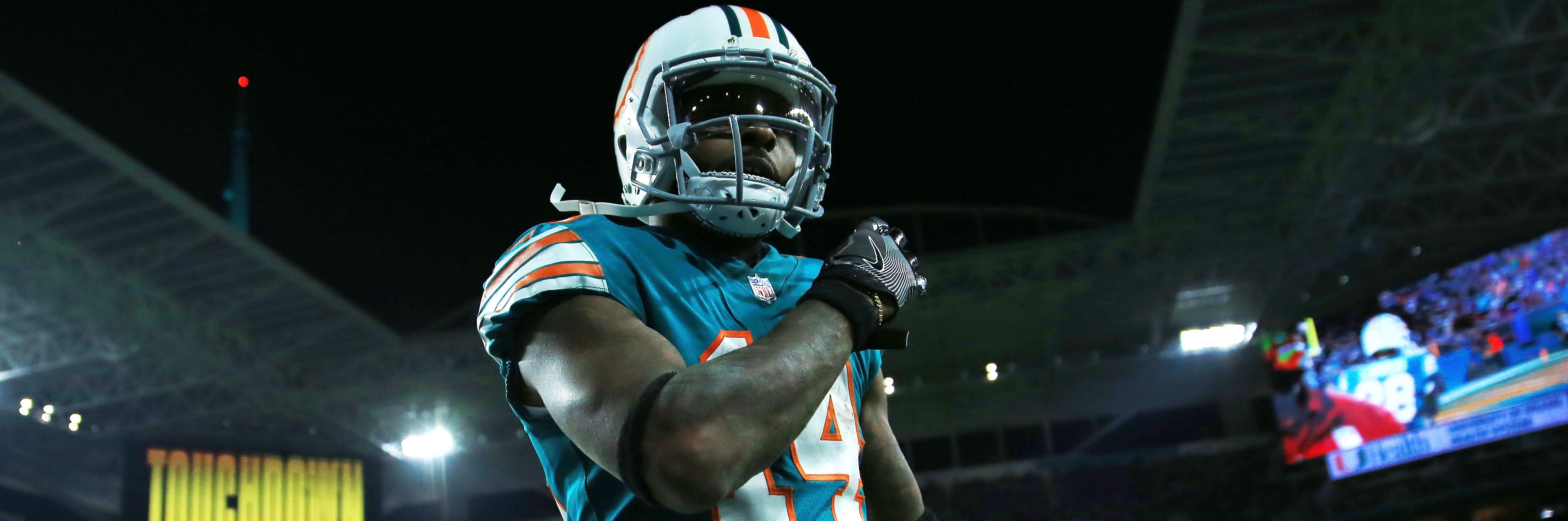 Jarvis Landry #14 of the Miami Dolphins celebrates a touchdown by teammate  Jakeem Grant #19 in the third quarter against the New England Patriots at Hard Rock Stadium on December 11, 2017.  (Photo by Chris Trotman/Getty Images)