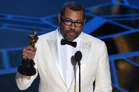 TOPSHOT - Director Jordan Peele delivers a speech after he won the Oscar for Best Original Screenplay for "Get Out" during the 90th Annual Academy Awards show on March 4, 2018 in Hollywood, California. / AFP PHOTO / Mark Ralston        (Photo credit should read MARK RALSTON/AFP/Getty Images)