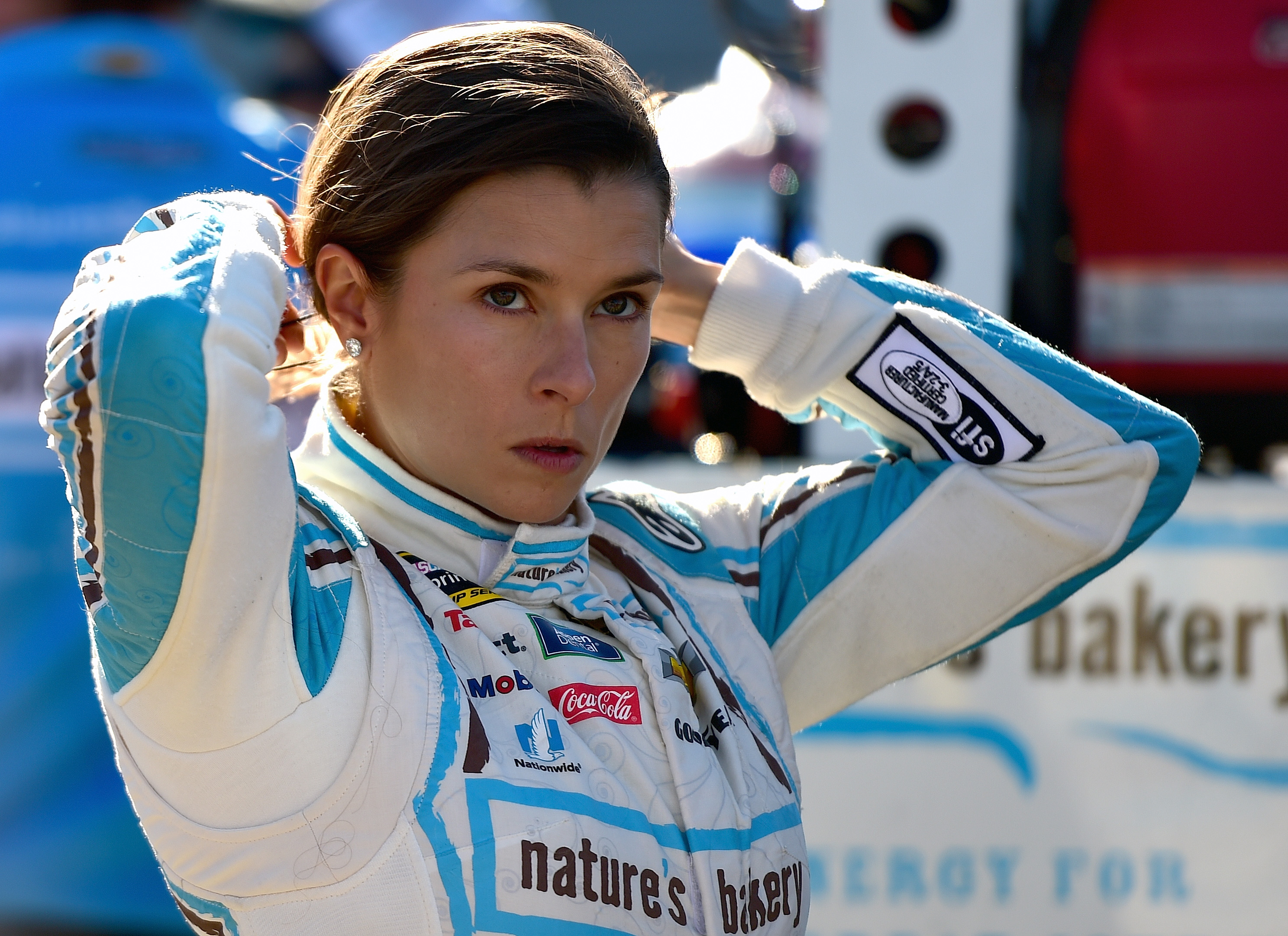 Danica Patrick, driver of the #10 Nature's Bakery Chevrolet, stands on the grid during qualifying for the NASCAR Sprint Cup Series Hellmann's 500 at Talladega Superspeedway on October 22, 2016. (Photo by Jared C. Tilton/Getty Images)