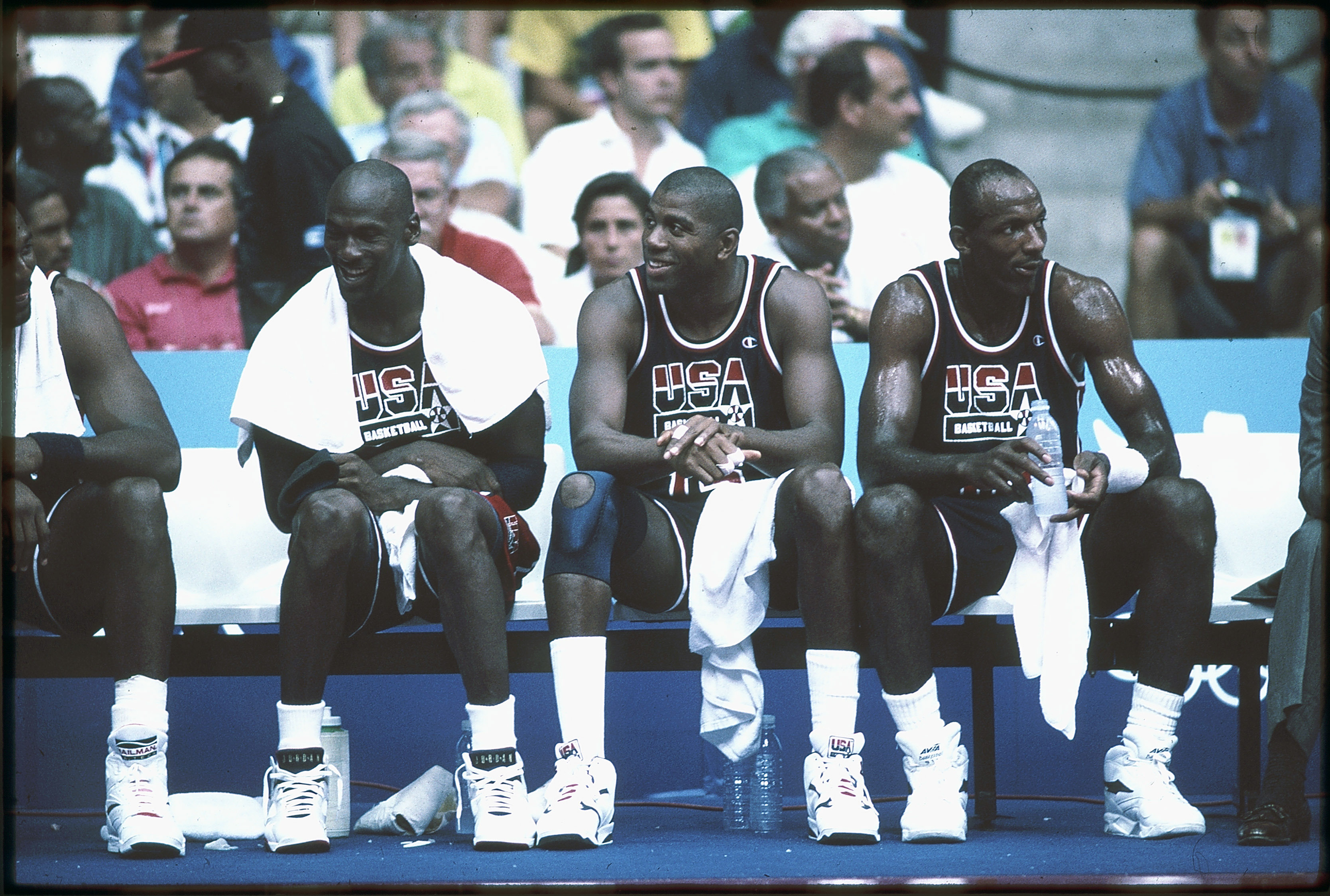1992:  Michael Jordan (L), Magic Johnson (M) and Clyde Drexler (R) of Team USA, the Dream Team, sit on the bench during the men's basketball competition at the 1992 Summer Olympics in Barcelona, Spain. (Photo by Icon Sportswire)