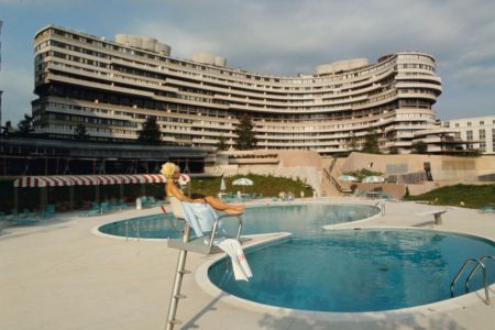 Lifeguard Linda Fox sits poolside at the Watergate complex, Washington DC, 1969. In the center rear is the Watergate East co-op apartment building. (Photo by Michael Rougier/The LIFE Picture Collection/Getty Images)