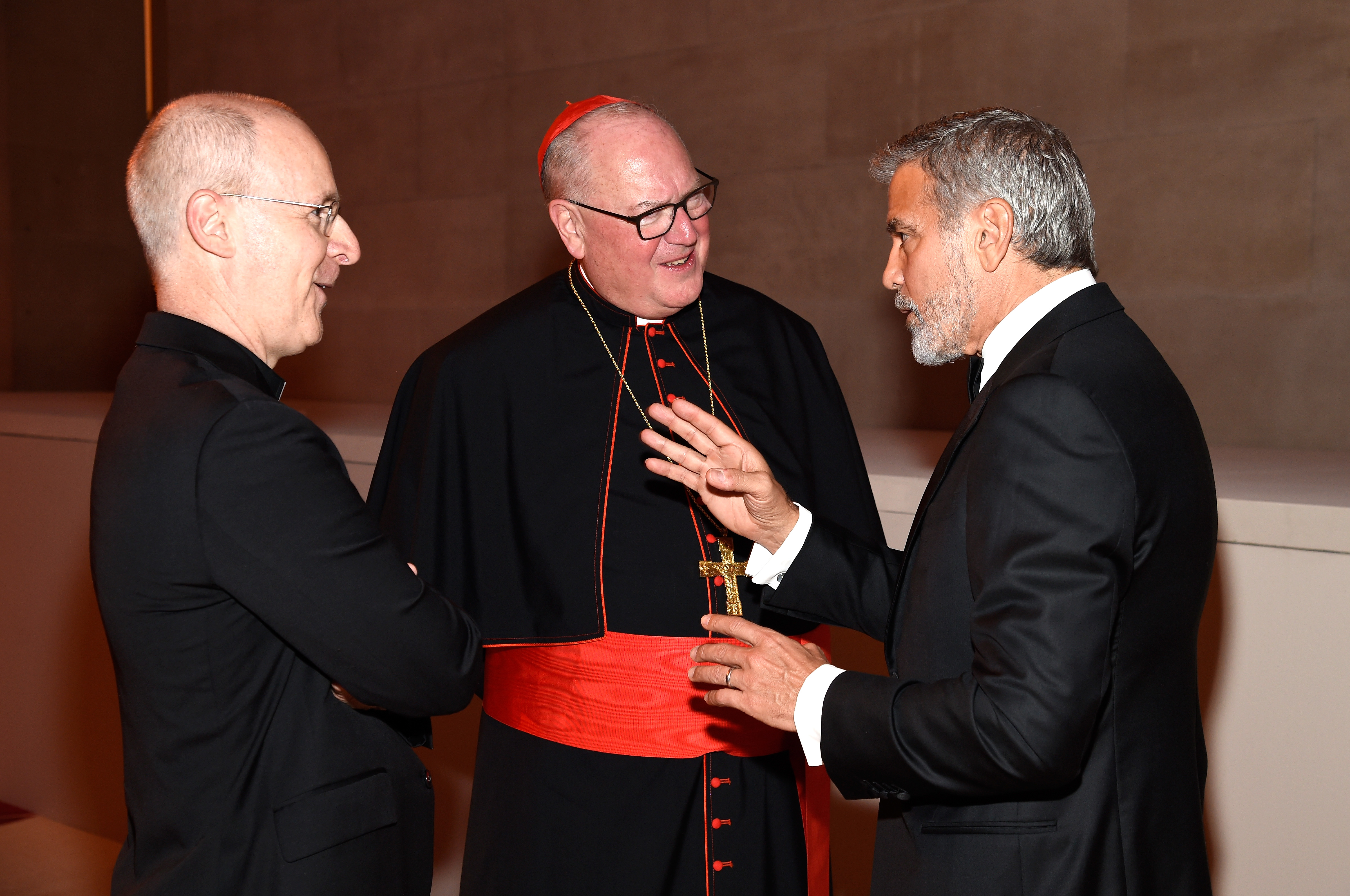Fr. James Martin, Cardinal Timothy Dolan, George Clooney attend the" Heavenly Bodies: Fashion & The Catholic Imagination Costume Institute Gala at The Metropolitan Museum of Art on May 7, 2018.  (Kevin Mazur/MG18/Getty Images for The Met Museum/Vogue)