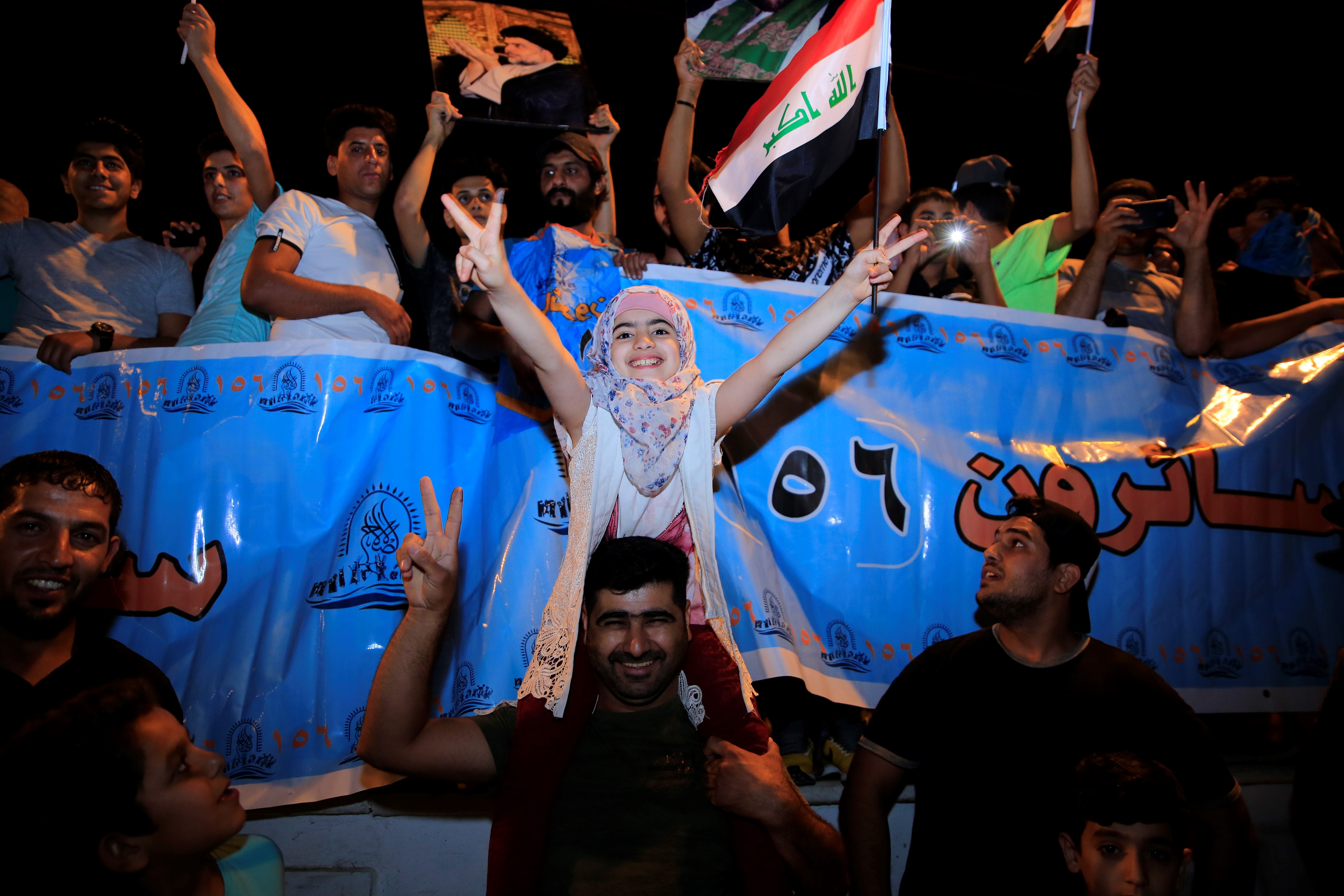 Supporters of Iraqi Shiite cleric Moqtada al-Sadr celebrate the results of the parliamentary election at the Tahrir Square, Baghdad, Iraq.
 (Murtadha Sudani/Anadolu Agency/Getty Images)