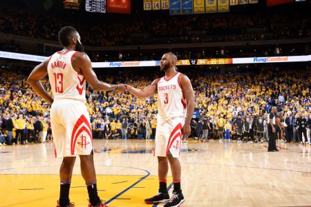 Chris Paul #3 and James Harden #13 of the Houston Rockets shake hands during Game Four of the Western Conference Finals during the 2018 NBA Playoffs on May 20, 2018 at ORACLE Arena in Oakland, California. (Photo by Andrew D. Bernstein/NBAE via Getty Images)