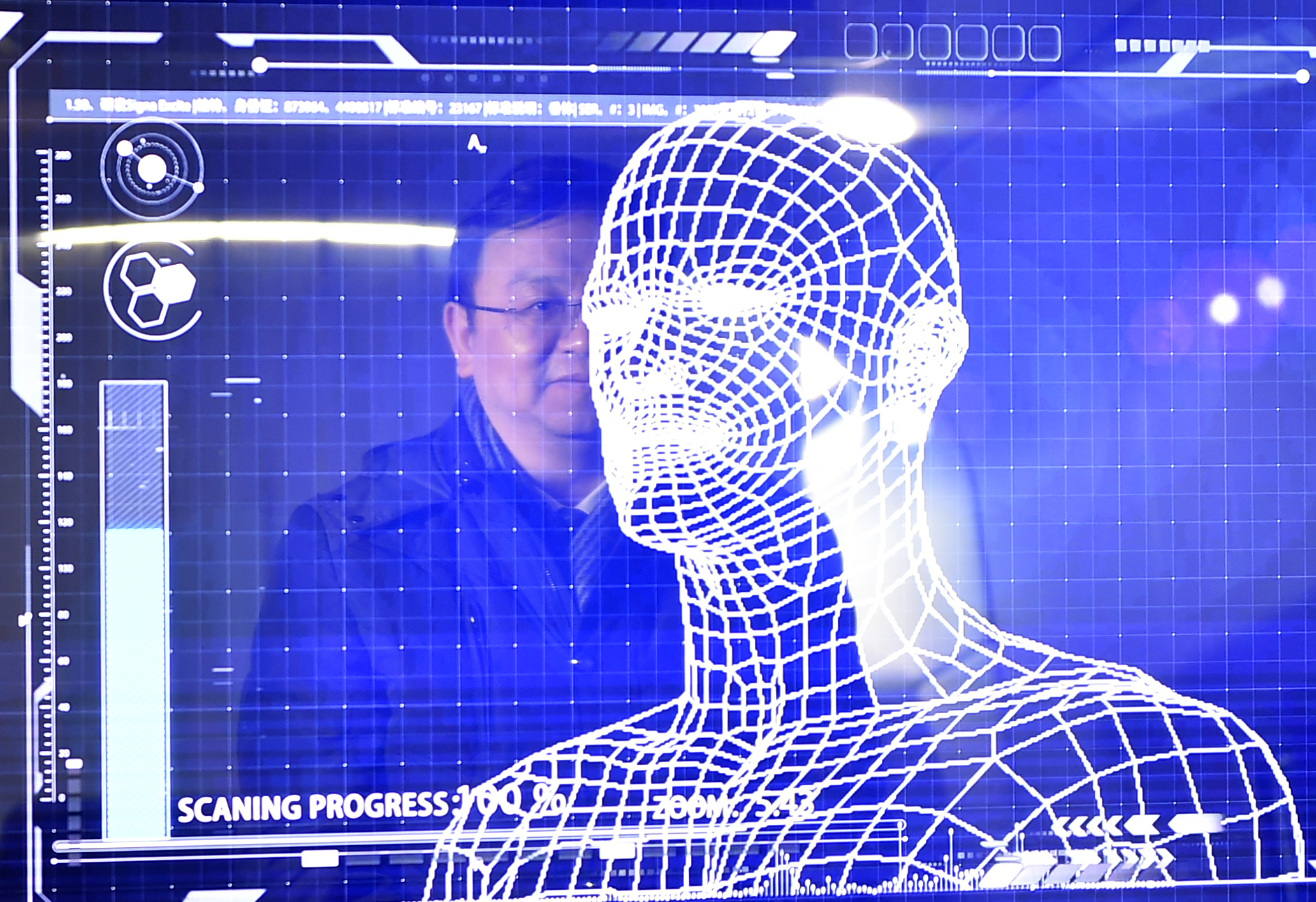 A manager of China's leading new energy vehicle maker BYD tries the facial recognition for starting a "Yungui" train during the launching of the "Yungui" system, a driverless monorail transit system, in Yinchuan, capital of northwest China's Ningxia Hui Autonomous Region, Jan. 10, 2018.
(Xinhua/Wang Peng via Getty Images)