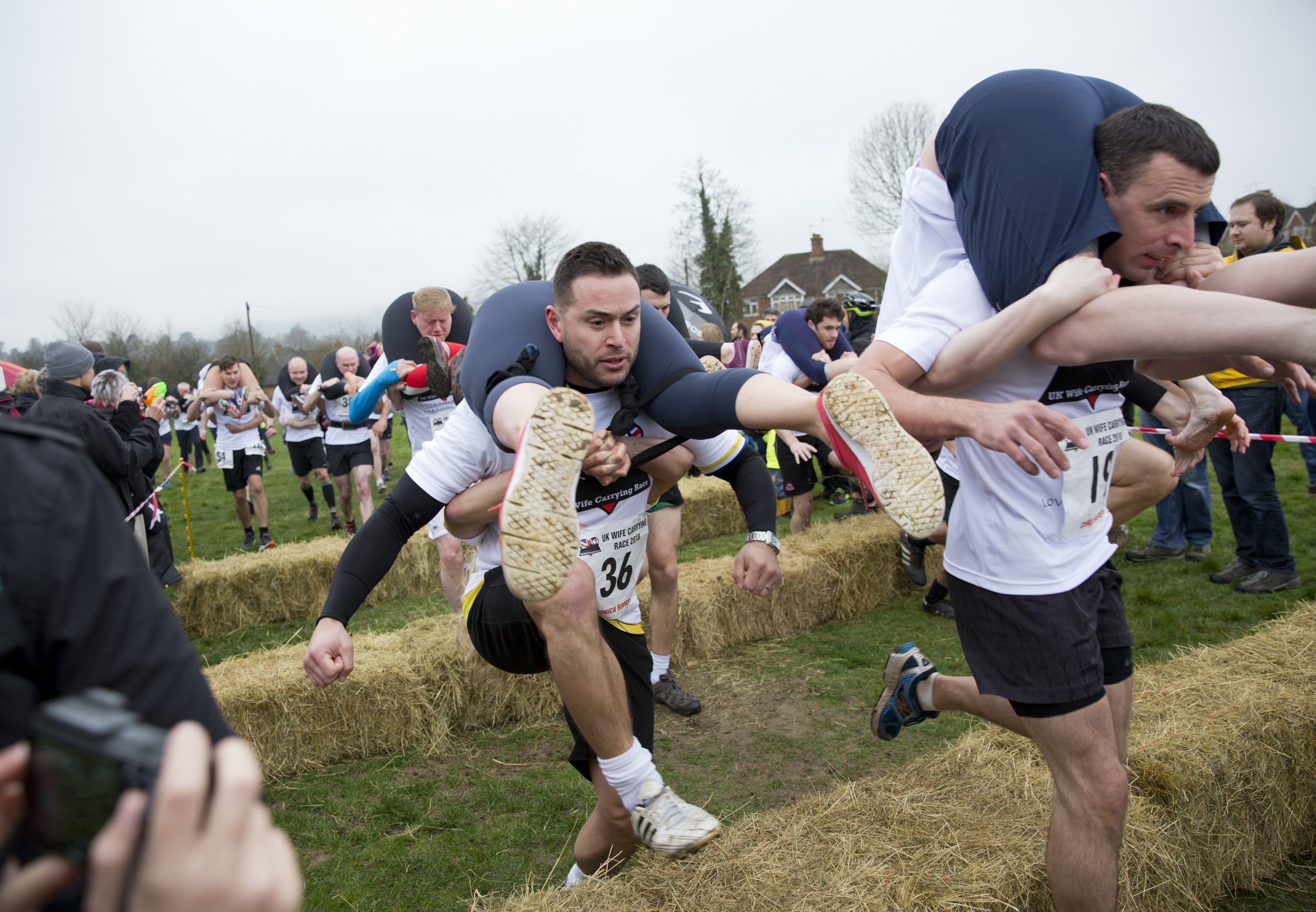 Competitors take part in the 2018 Wife Carrying Race in Dorking, Surrey, England on April 8, 2018." (Isabel Infantes/Anadolu Agency/Getty Images)