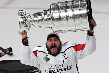 Alex Ovechkin #8 of the Washington Capitals hoists the Stanley Cup after the team's 4-3 win over the Vegas Golden Knights in Game Five of the 2018 NHL Stanley Cup Final at T-Mobile Arena on June 7, 2018 in Las Vegas, Nevada.  (Photo by Ethan Miller/Getty Images)