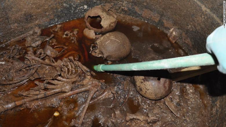 Handout picture released by the Egyptian Ministry of Antiquities shows disintegrated mummies within the sarcophagus. 
