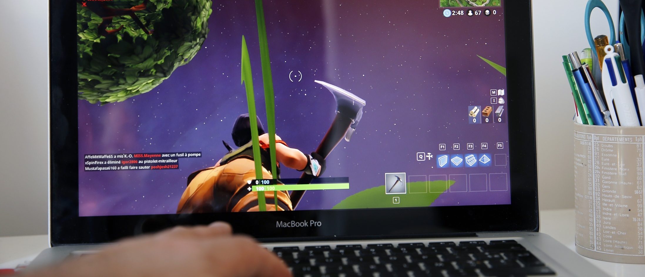 A gamer plays the video game "Fortnite: Battle Royale" developed by People Can Fly and Epic Games on May 03, 2018 in Paris, France.  (Photo by Chesnot/Getty Images)