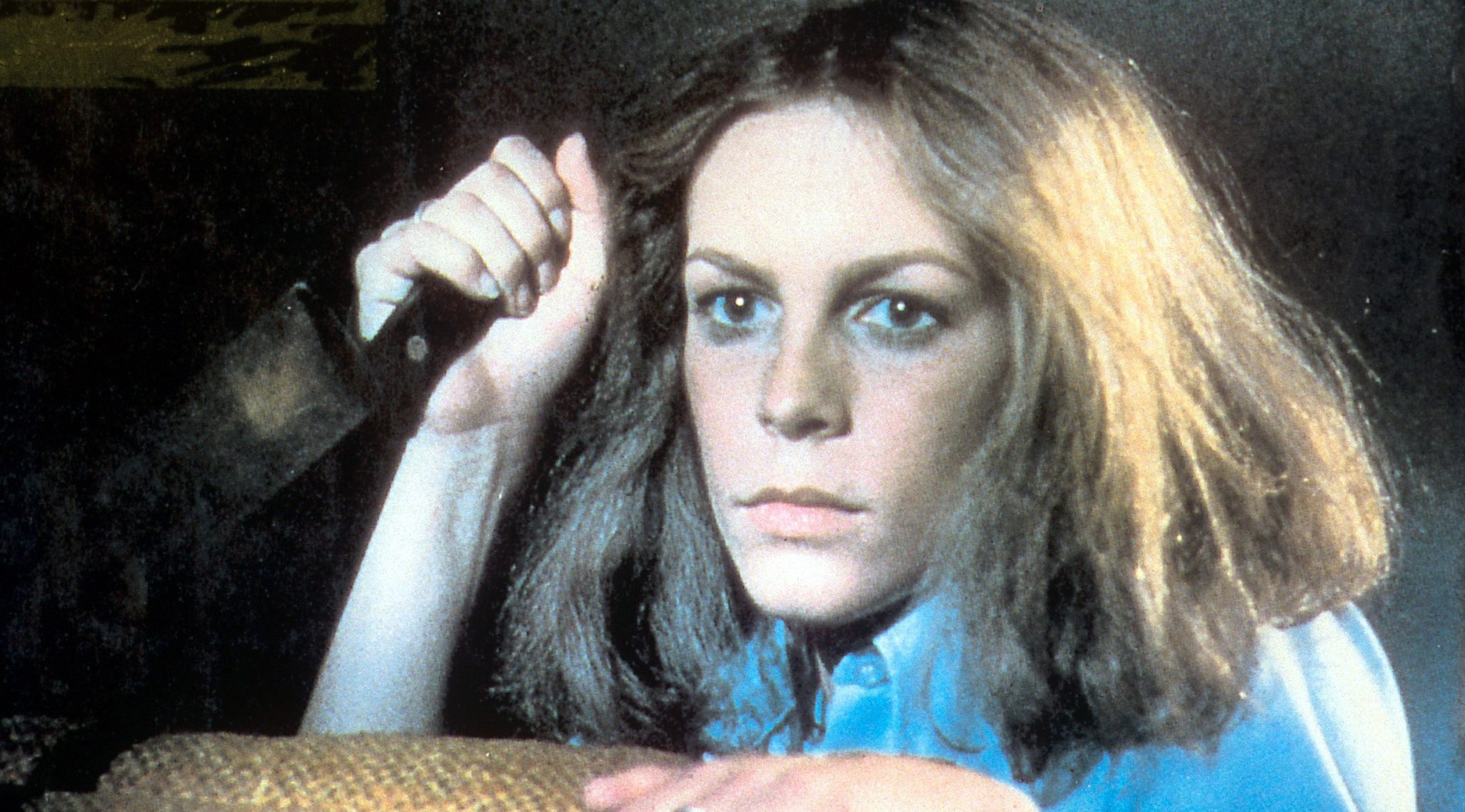 Jamie Lee Curtis holds a knife in a scene from the film 'Halloween', 1978. (Photo by Compass International Pictures/Getty Images)