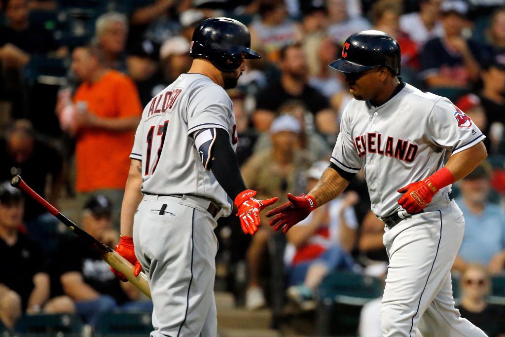 CHICAGO, IL - AUGUST 11: Jose Ramirez #11 of the Cleveland Indians (R) is congratulated by Yonder Alonso #17 after hitting a home run against the Chicago White Sox during the sixth inning at Guaranteed Rate Field on August 11, 2018 in Chicago, Illinois.  (Photo by Jon Durr/Getty Images)