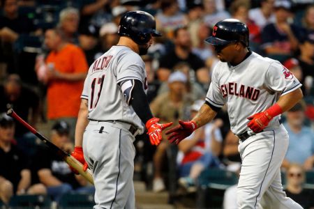 CHICAGO, IL - AUGUST 11: Jose Ramirez #11 of the Cleveland Indians (R) is congratulated by Yonder Alonso #17 after hitting a home run against the Chicago White Sox during the sixth inning at Guaranteed Rate Field on August 11, 2018 in Chicago, Illinois.  (Photo by Jon Durr/Getty Images)