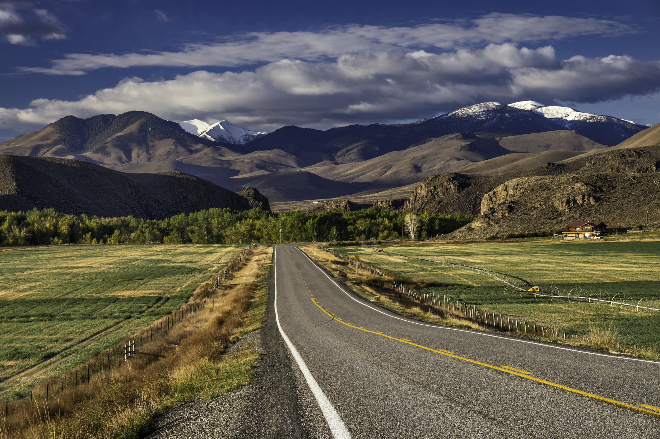 Pioneer Mountains over Round Valley, Land of the Yankee Fork, from highway near Challis, Rocky Mountains, Salmon River Scenic Byway, Idaho, USA.