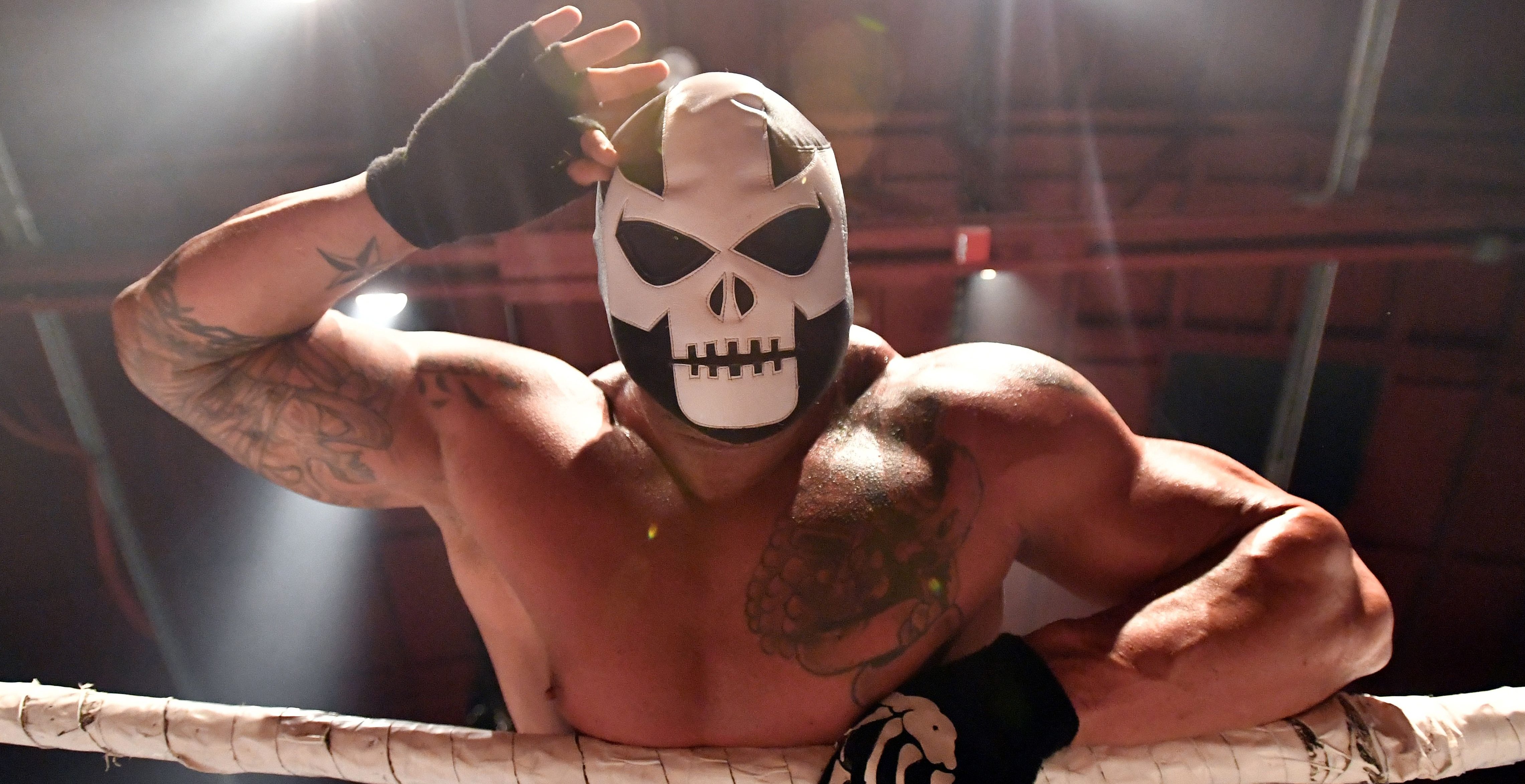 A wrestler who goes by the name Super Beast looks towards a cheering crowd after entering the ring during Hoodslam, an underground professional wrestling event, in Oakland, California on July 7, 2017.   (JOSH EDELSON/AFP/Getty Images)