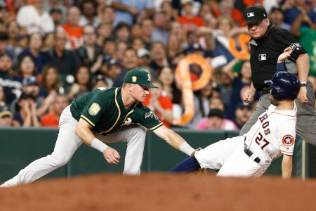 HOUSTON, TX - JULY 09:  Matt Chapman #26 of the Oakland Athletics tags out Jose Altuve #27 of the Houston Astros as he tried to advance on passed ball in the fourth inning at Minute Maid Park on July 9, 2018 in Houston, Texas.  (Photo by Bob Levey/Getty Images)