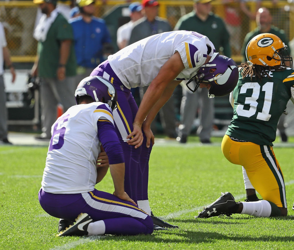 GREEN BAY, WI - SEPTEMBER 16: Daniel Carlson #7 of the Minnesota Vikings (R) reacts after missing a potential game-winning field goal in overtime against the Green Bay Packers  at Lambeau Field on September 16, 2018 in Green Bay, Wisconsin. The Vikings and the Packers tied 29-29 after overtime. (Photo by Jonathan Daniel/Getty Images)