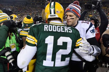 GREEN BAY, WI - NOVEMBER 30:  Tom Brady #12 of the New England Patriots (R) congratulates fellow quarterback Aaron Rodgers #12 of the Green Bay Packers after their game at Lambeau Field on November 30, 2014 in Green Bay, Wisconsin.  The Packers defeated the Patriots 26-21. (Photo by Brian D. Kersey/Getty Images)