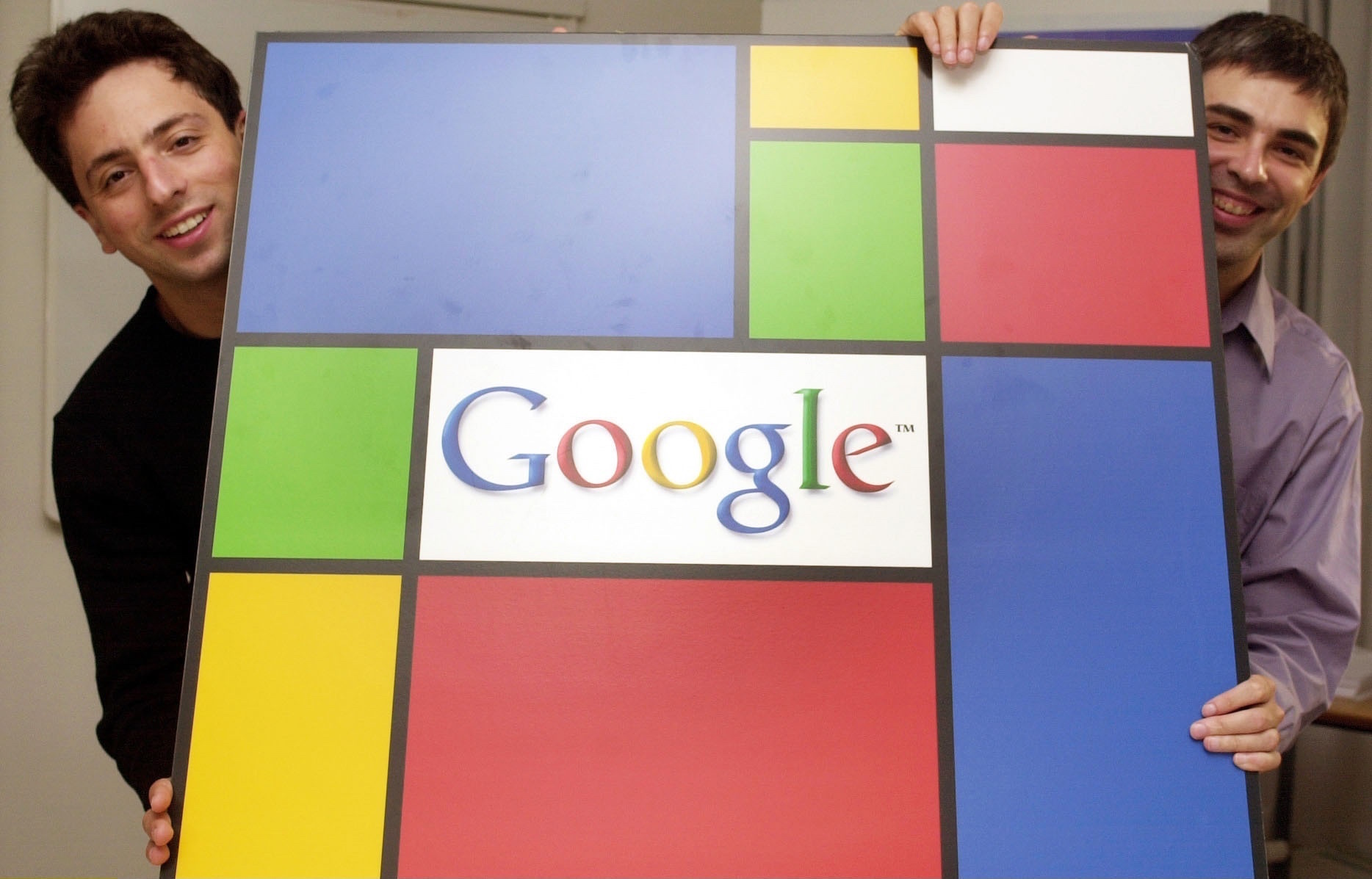 Google founders Sergey Brin (L) and Larry Page (R) pose with the company's logo. The company celebrates the 20th anniversary of its incorporation this month.  (Photo by JOKER/Martin Magunia/ullstein bild via Getty Images)