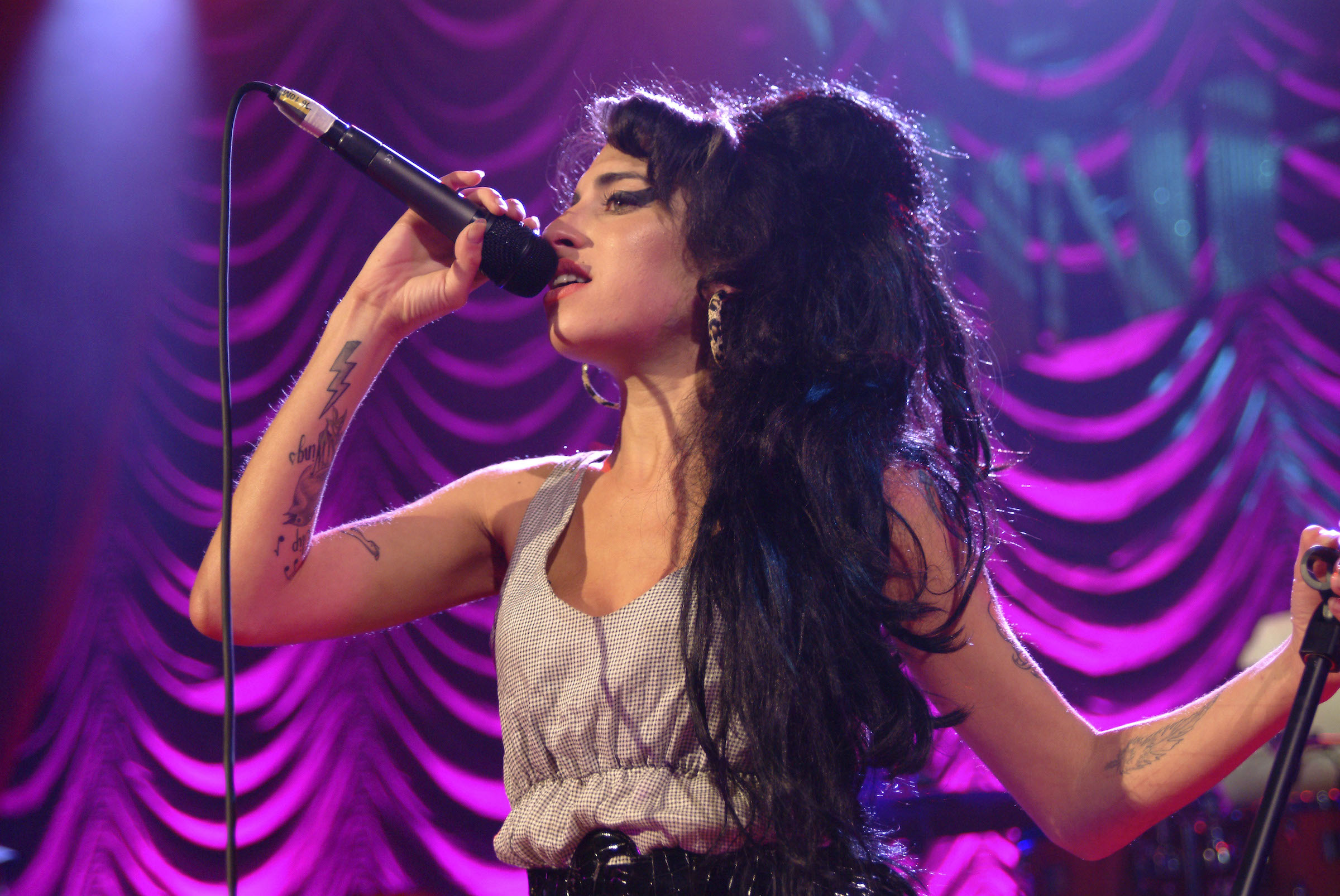 Photo of Amy Winehouse, performing live on stage. A hologram of Winehouse will soon go on tour. (Photo by C Brandon/Redferns/Getty Images)