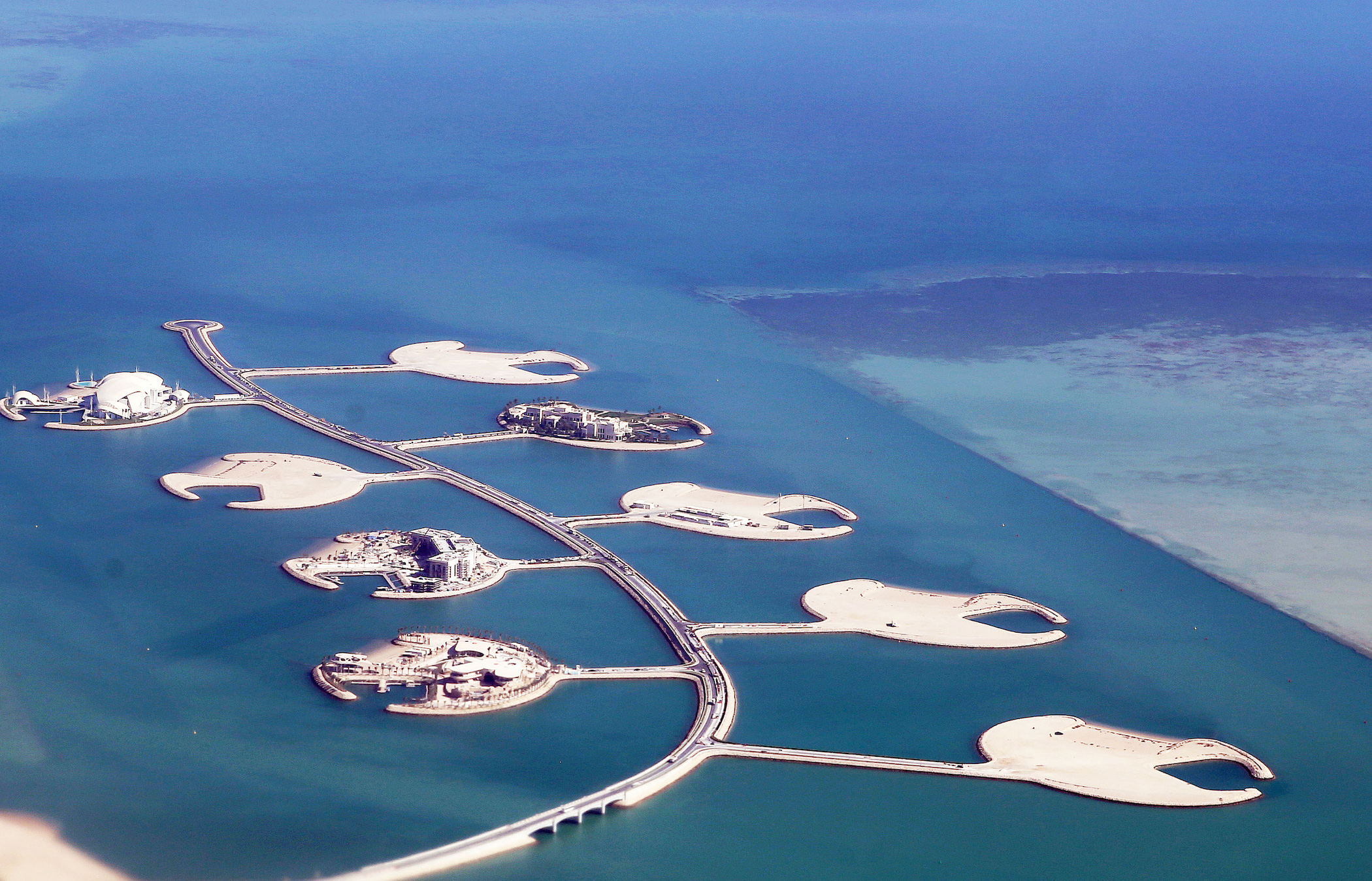An aerial view taken on December 3, 2017, shows a partial view of the Pearl-Qatar artificial Island in the capital Doha. Hong Kong is currently considering a project to build its own artificial islands. (Photo by YASSER AL-ZAYYAT/AFP/Getty Images)