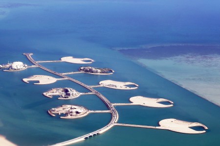 An aerial view taken on December 3, 2017, shows a partial view of the Pearl-Qatar artificial Island in the capital Doha. Hong Kong is currently considering a project to build its own artificial islands. (Photo by YASSER AL-ZAYYAT/AFP/Getty Images)