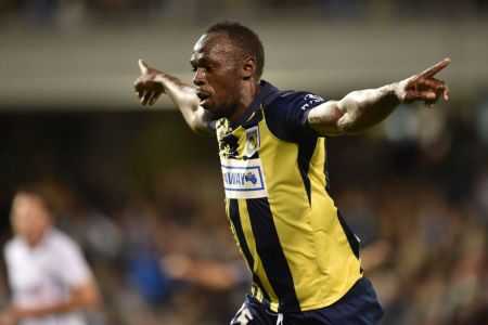 Olympic sprinter Usain Bolt celebrates scoring a goal for A-League football club Central Coast Mariners in his first competitive start for the club against Macarthur South West United in Sydney on October 12, 2018. (PETER PARKS/AFP/Getty Images)