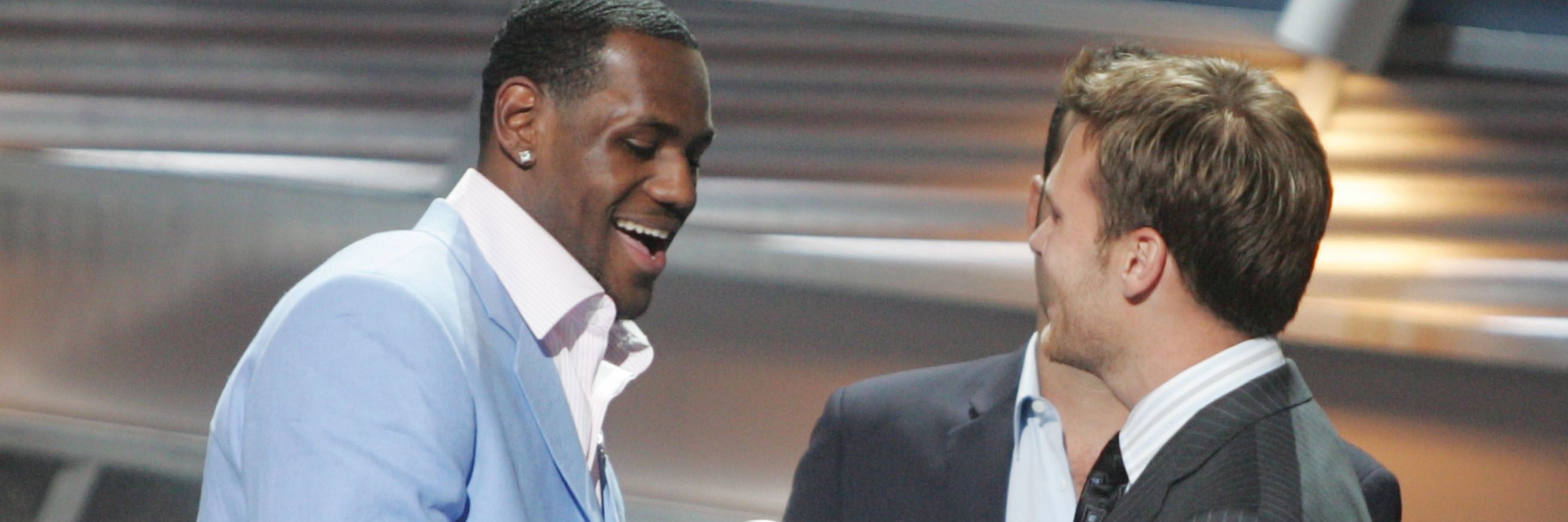 HOLLYWOOD - JULY 14:  Winner for Best Breakthrough athlete, basketball player LeBron James is greeted on stage by quarterback Tom Brady at the 12th Annual ESPY Awards held at the Kodak Theatre on July 14, 2004 in Hollywood, California.  This year's ESPY's will air Sunday, July 16th on ESPN beginning 9 PM EST/6 PM EST.  (Photo by Carlo Allegri/Getty Images)