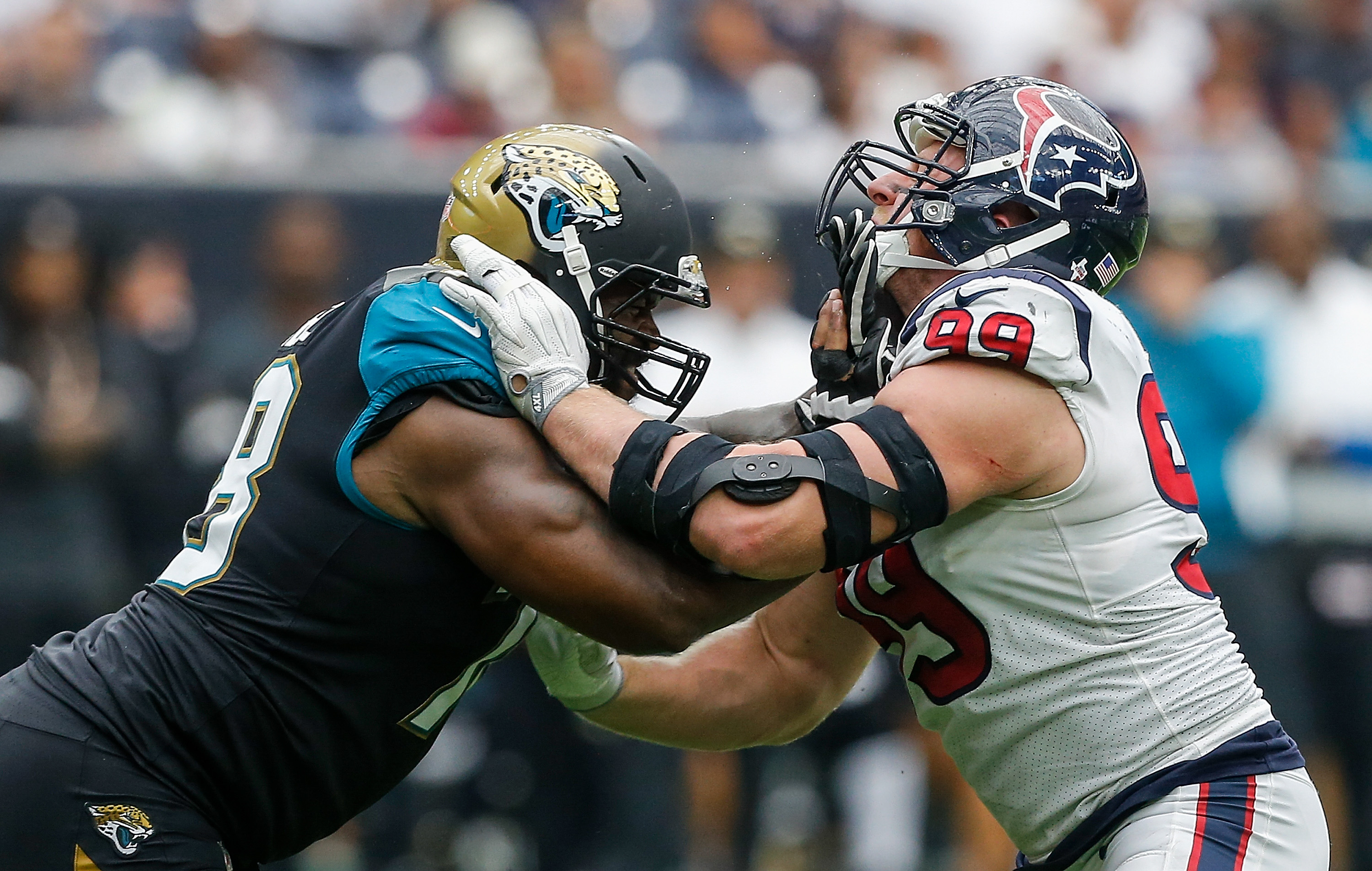HOUSTON, TX - SEPTEMBER 10:  Jermey Parnell #78 of the Jacksonville Jaguars and J.J. Watt #99 of the Houston Texans lock up at NRG Stadium on September 10, 2017 in Houston, Texas.  (Photo by Bob Levey/Getty Images)