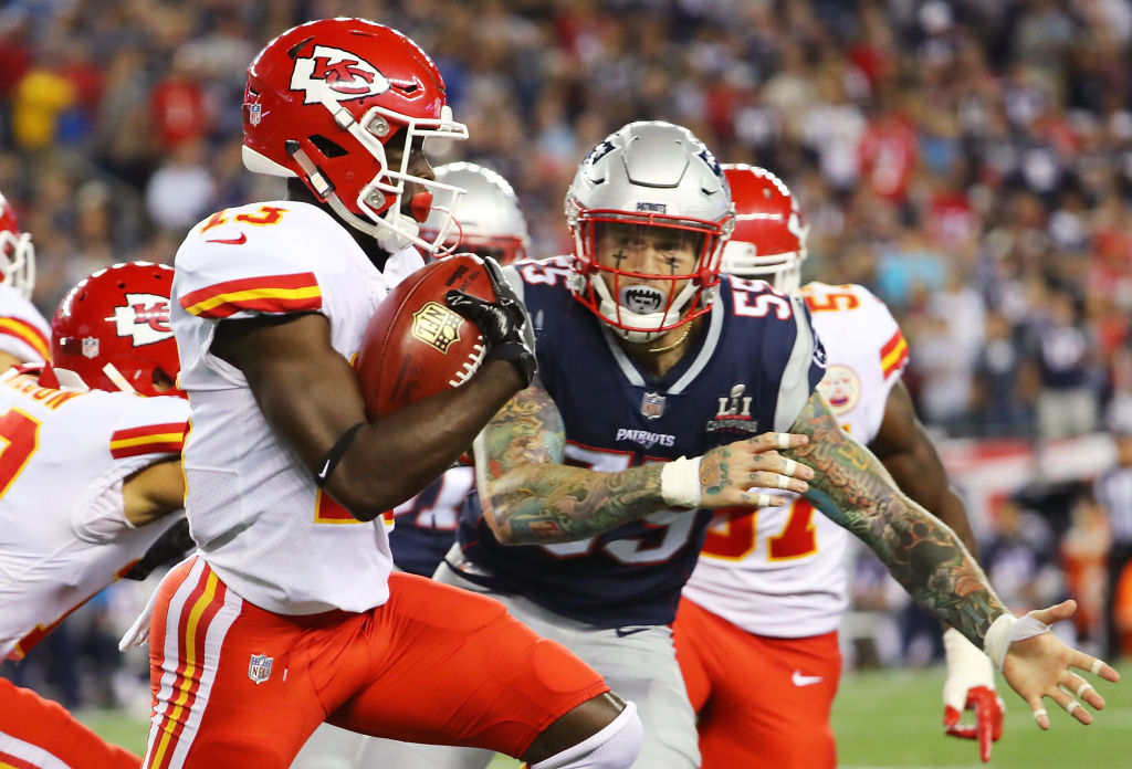 FOXBORO, MA - SEPTEMBER 07:  De'Anthony Thomas #13 of the Kansas City Chiefs runs the ball before being tackled by Cassius Marsh #55 of the New England Patriots during a game against the New England Patriots during the second half at Gillette Stadium on September 7, 2017 in Foxboro, Massachusetts.  (Photo by Adam Glanzman/Getty Images)