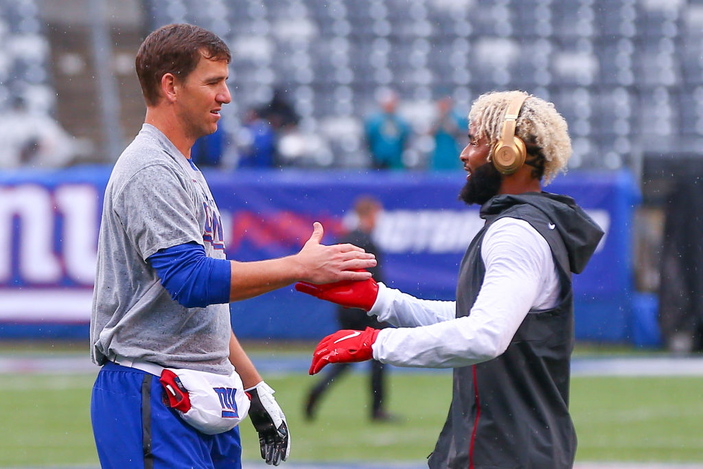 EAST RUTHERFORD, NJ - SEPTEMBER 09:  New York Giants quarterback Eli Manning (10) and New York Giants wide receiver Odell Beckham (13) shake hands prior to the National Football League game between the New York Giants and the Jacksonville Jaguars on September 9, 2018 at MetLife Stadium in East Rutherford, NJ.  (Photo by Rich Graessle/Icon Sportswire via Getty Images)