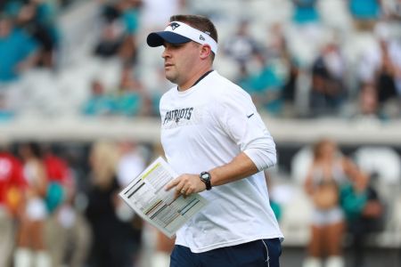 JACKSONVILLE, FL - SEPTEMBER 16:  New England Patriots offensive coordinator Josh McDaniels walks to the field before their game against the Jacksonville Jaguars at TIAA Bank Field on September 16, 2018 in Jacksonville, Florida.  (Photo by Scott Halleran/Getty Images)