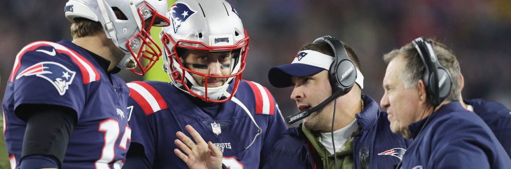 FOXBOROUGH, MA - NOVEMBER 04:  Tom Brady #12 talks with Brian Hoyer #2, offensive coordinator Josh McDaniels and head coach Bill Belichick of the New England Patriots during the first half against the Green Bay Packers at Gillette Stadium on November 4, 2018 in Foxborough, Massachusetts.  (Photo by Maddie Meyer/Getty Images)