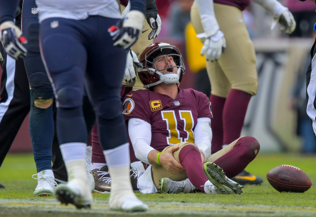 Washington Redskins quarterback Alex Smith (11) reacts to an injury in the third quarter during a game between the Washington Redskins  and the Houston Texans at FedEX Field on November 18, 2018, in Landover, MD. (Photo by John McDonnell/The Washington Post via Getty Images)