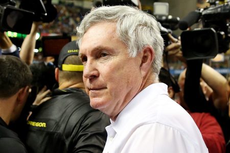 Head coach Mack Brown of the Texas Longhorns meets head coach Mark Helfrich of the Oregon Ducks on the field after the Valero Alamo Bowl at the Alamodome on December 30, 2013 in San Antonio, Texas. The Oregon Ducks defeated the Texas Longhorns 30-7.  (Photo by Ronald Martinez/Getty Images)