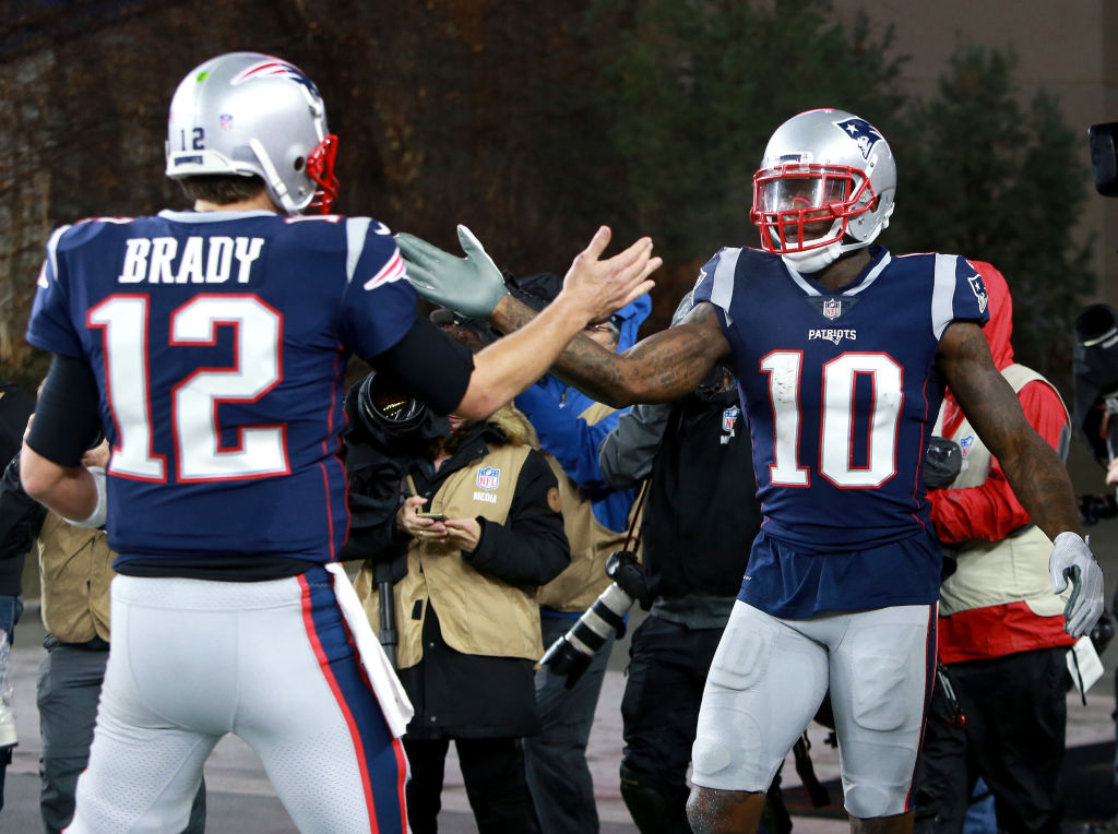 FOXBOROUGH, MA - DECEMBER 2: Patriots quarterback Tom Brady (left) congratulates Josh Gordon after his touchdown  in the third quarter. The New England Patriots play against the Minnesota Vikings at Gillette Stadium in Foxborough on Dec. 02, 2018. (Photo by Jim Davis/The Boston Globe via Getty Images)